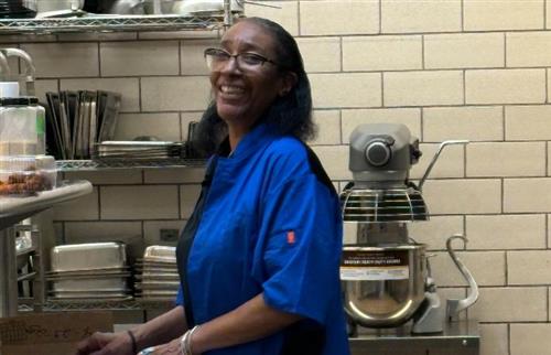  Ms. Powell standing in the kitchen